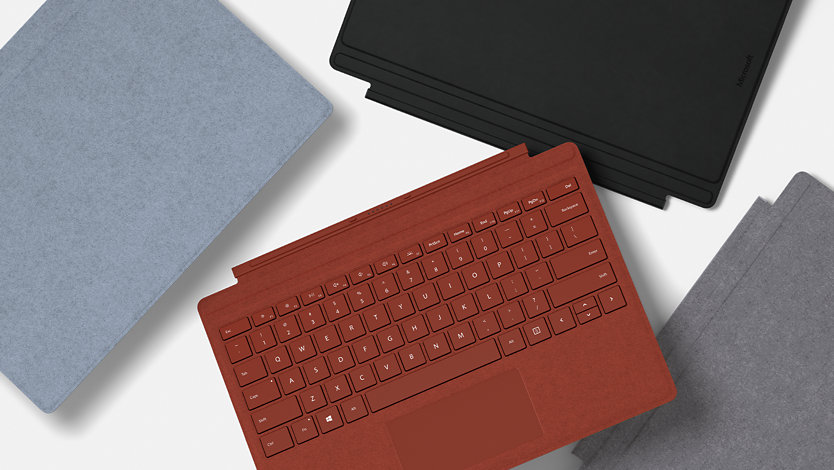 Fyra Surface Pro Signature Type Cover-tillbehör för företag.