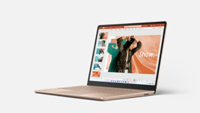 Surface Laptop Go in Sandstone with PowerPoint onscreen.
