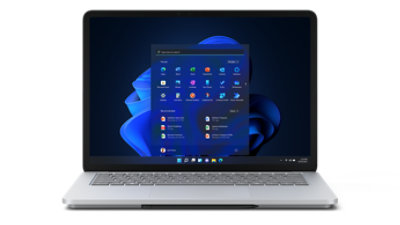 Render of Laptop Studio with Windows 11 dark mode start screen front on in laptop mode