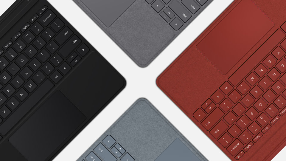 Top down view of Surface Type Covers in black, poppy red, platinum and ice blue.