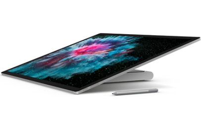 Side view of Surface Studio 2 in studio mode with Surface Pen.