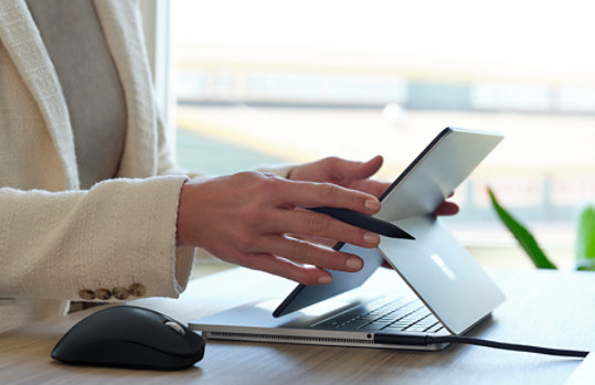 Side view of person using Surface Laptop Studio.