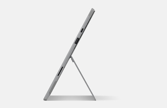 Side-view of Surface Pro 7+ on kickstand featuring USB-C, USB, and charging ports.