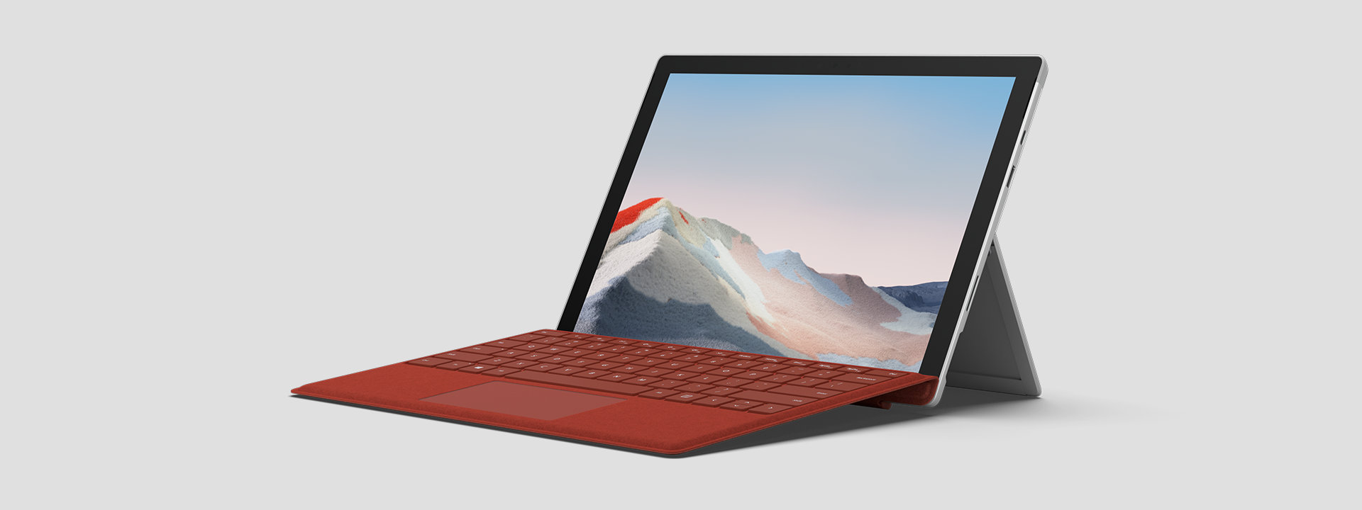 Surface Pro 7+ para empresas reposado sobre el soporte trasero y mostrando la pantalla y teclado.