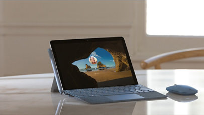 A Surface device on a desk running Windows 10 Pro.