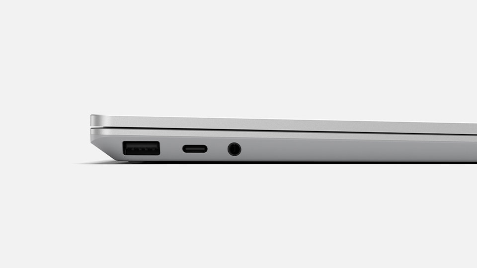 The side profile of a surface Laptop Go featuring the headphone jack, charging location and USB input.