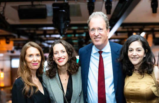group of people posing for photo