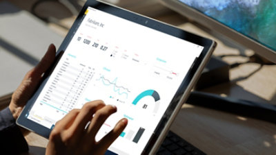 Microsoft Surface showing graphs and charts with data