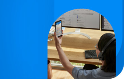 A person using their mobile phone to verify a new credential.