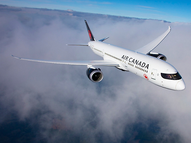 An Air Canada plane flying in the sky