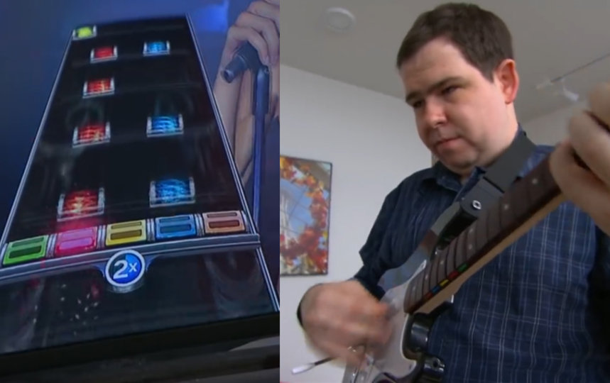 Christopher Pauley playing a guitar for the video game Rock Band