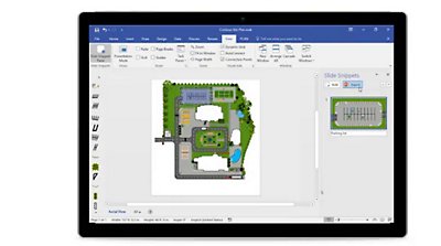 Multiple paint swatches in a basket and a tablet device showing a floorplan in PowerPoint.