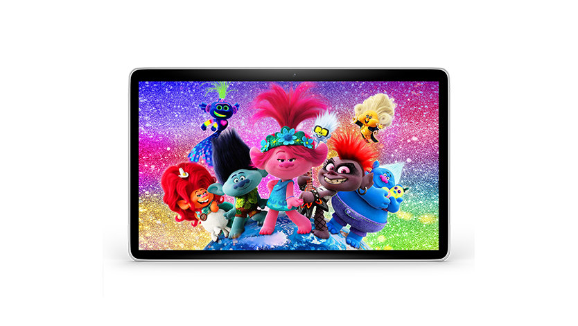 On a tablet screen, the Trolls pose standing on top of planet Earth, with a multicolor and glittery background