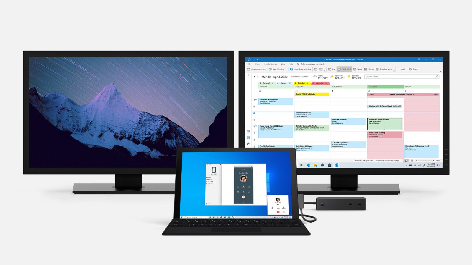 Un Surface Pro 7 y un Surface Dock 2 conectados a dos monitores grandes.