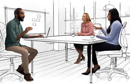 A group of three coworkers collaborating around a table. Their office environment is sketched; a work in progress.