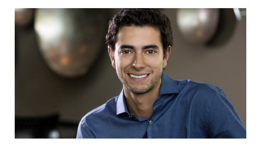 Daniel Hidalgo smiles in a corporate profile photo.