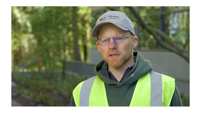 Kyle Van Allan wearing a safety vest outside a Microsoft building