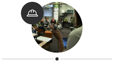 A group of people working in different areas at the original Inclusive Tech Lab.