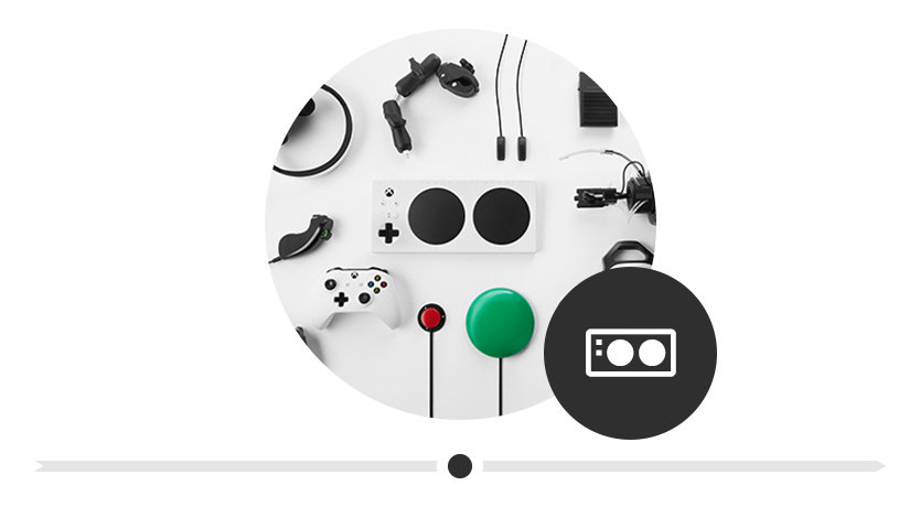An Xbox Adaptive Controller surrounded by its complimentary peripherals.