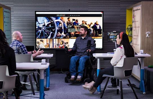 A group of people collaborating at the Inclusive Tech Lab.