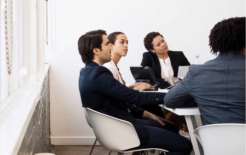 Small conference meeting in an office.