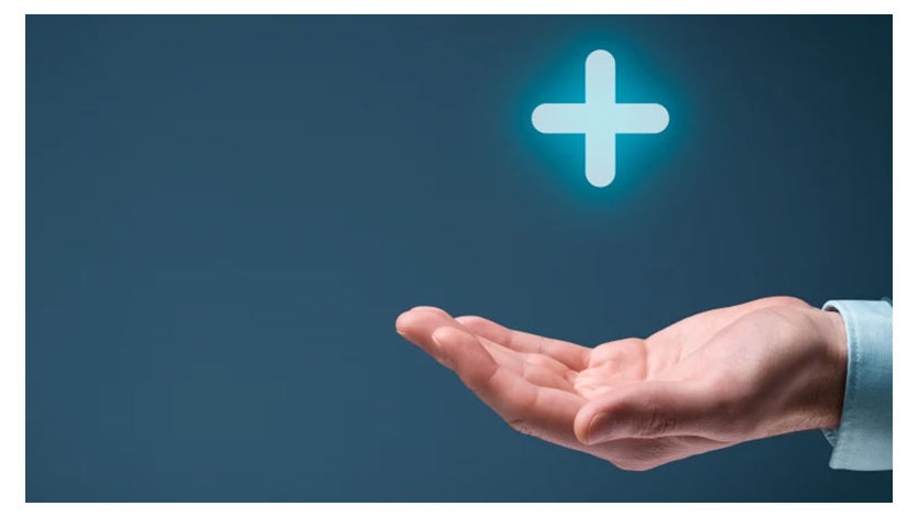 A photo of a person’s hand, palm facing up on a blue background