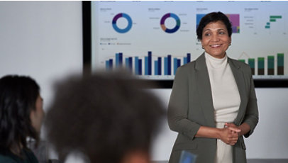 Businesswoman presenting a data dashboard in a conference room