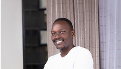 A photo of Samwel Kanda with hands folded.