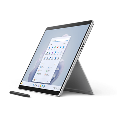 Platinum Surface Pro 9 with kickstand open and a Surface Pen.