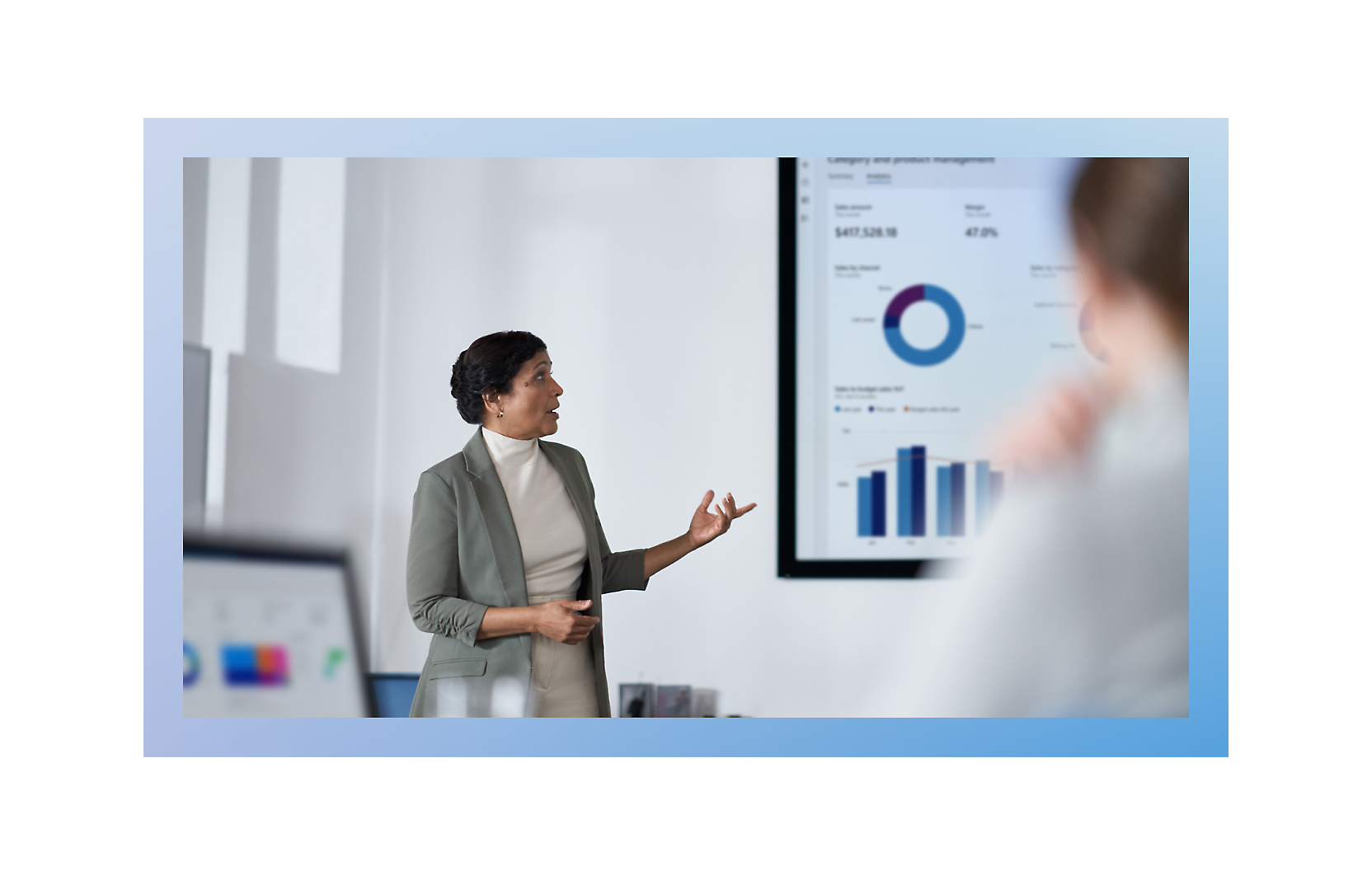 A screen shot of woman presenting graph in meeting