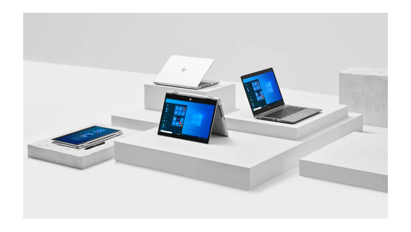 Several Windows laptops are displayed on a set of display boxes.