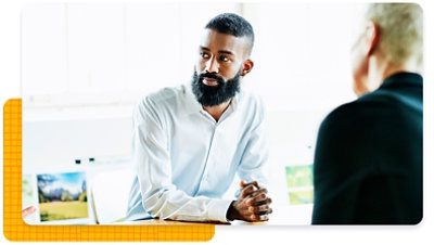 Man at a desk looking away