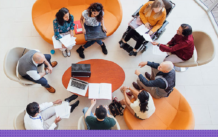 A casual meeting around a table viewed from above 