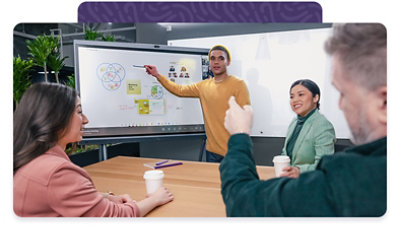 Group gathered in front of touchscreen having a discussion