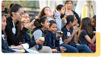 Group of kids sitting and laughing