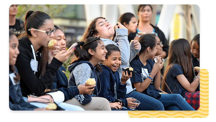 Group of kids sitting and laughing