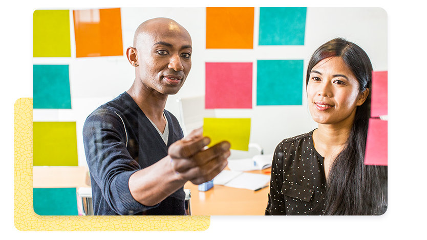 Two people reviewing project notes