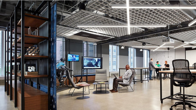 Open shelving leads to a large open area with flexible tables and seating.