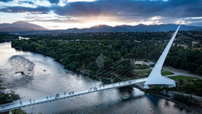 A pedestrian bridge spanning a river.