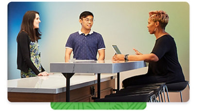 Three Microsoft employees having a conversation in a common break room