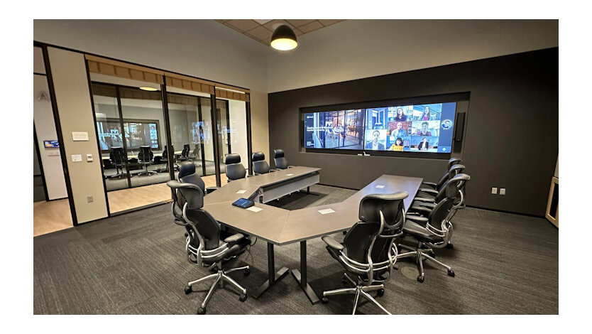 A meeting room at the Hive showing a conference room powered by Microsoft Teams Room.