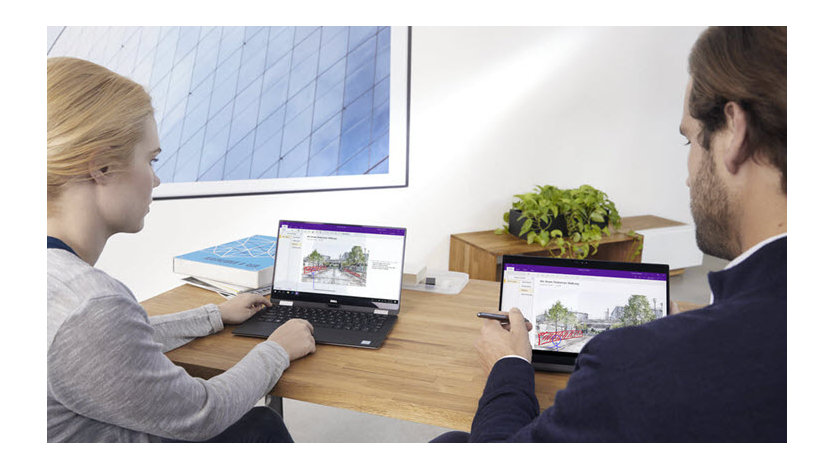 A manager and associate collaborating on an architectural project. They are editing the same property illustration on different machines using Windows Ink on OneNote.