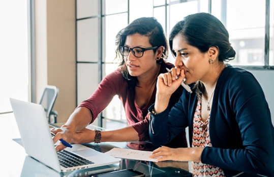 Two businesswomen meeting in an office.