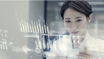 Female scientist looking at a futuristic display with data.