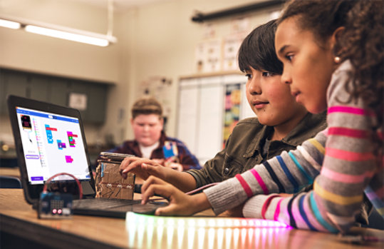 kids making a project with microbit