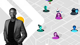  A person Standing in a suit and smilling