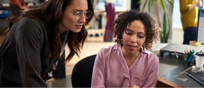 Two woman working in office