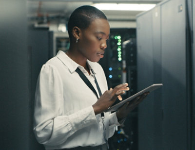 Person standing and using tablet