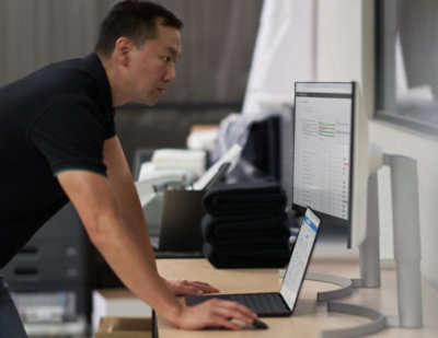 A man is looking at the laptop.