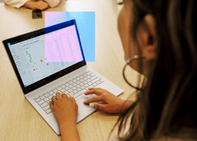 Woman typing on a laptop
